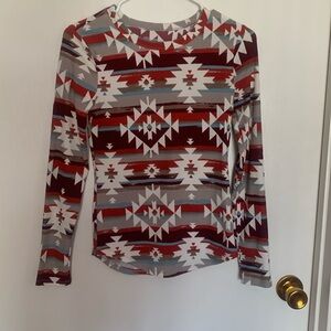 No Boundaries patterned long sleeve top. Women’s small. Extra long back.